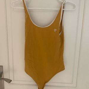 TNA mustard yellow bodysuit